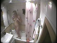 Unsuspecting sexy babe takes a shower
